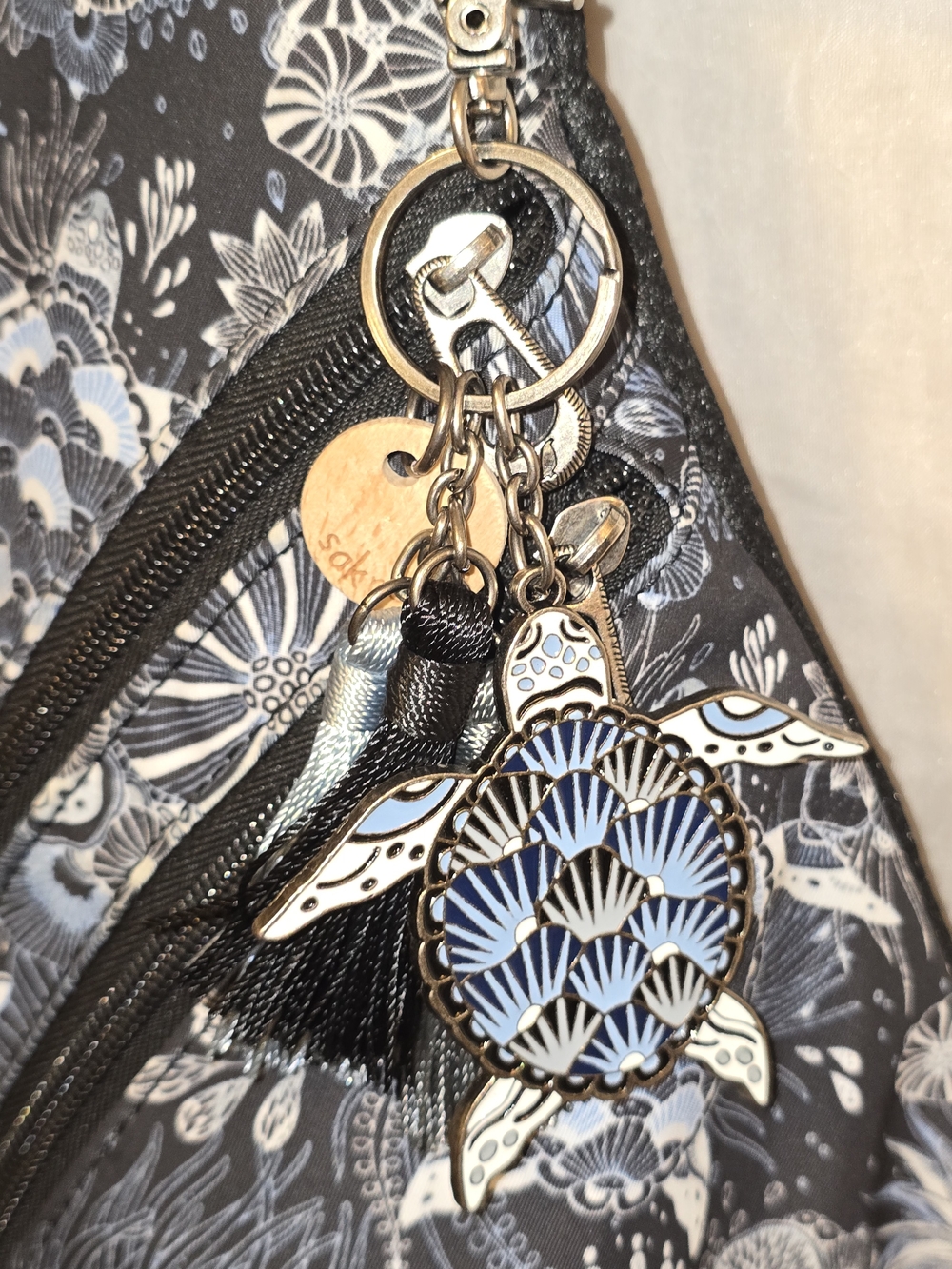 Sakroots Midnight Seascape Sling Backpack with Turtle Charm Key Chain